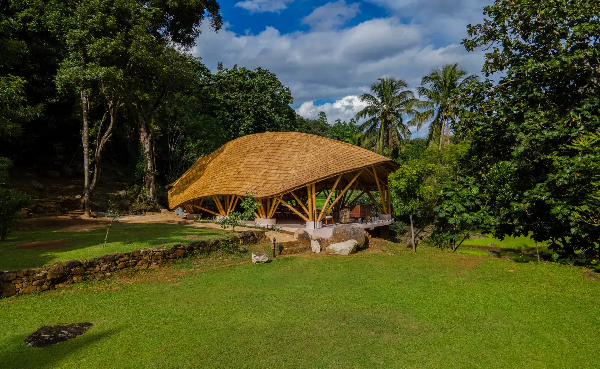 The bamboo-roofed pavilion among the trees