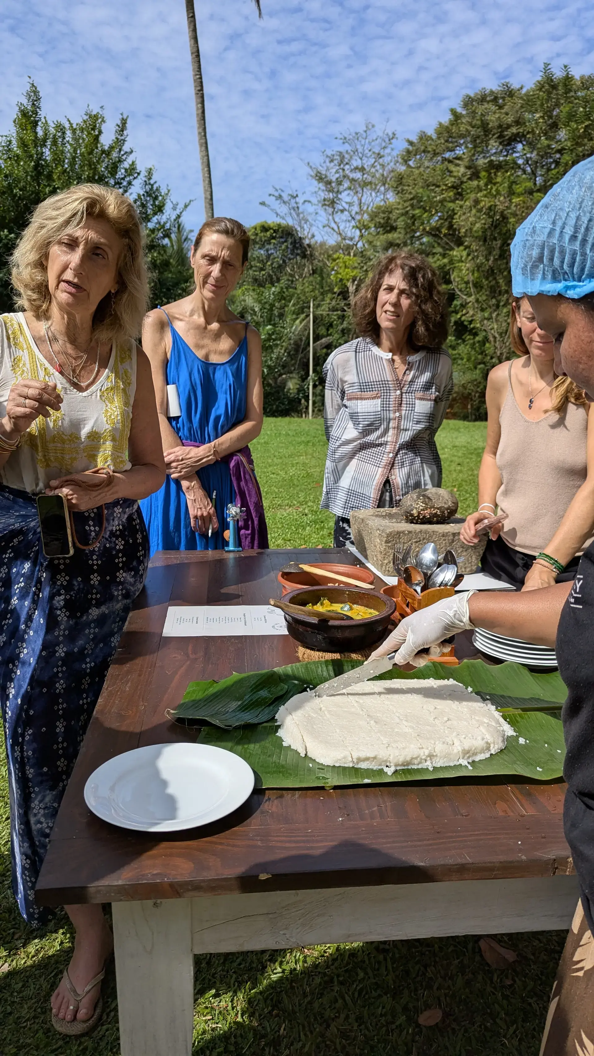 A village cooking class over a wood fire